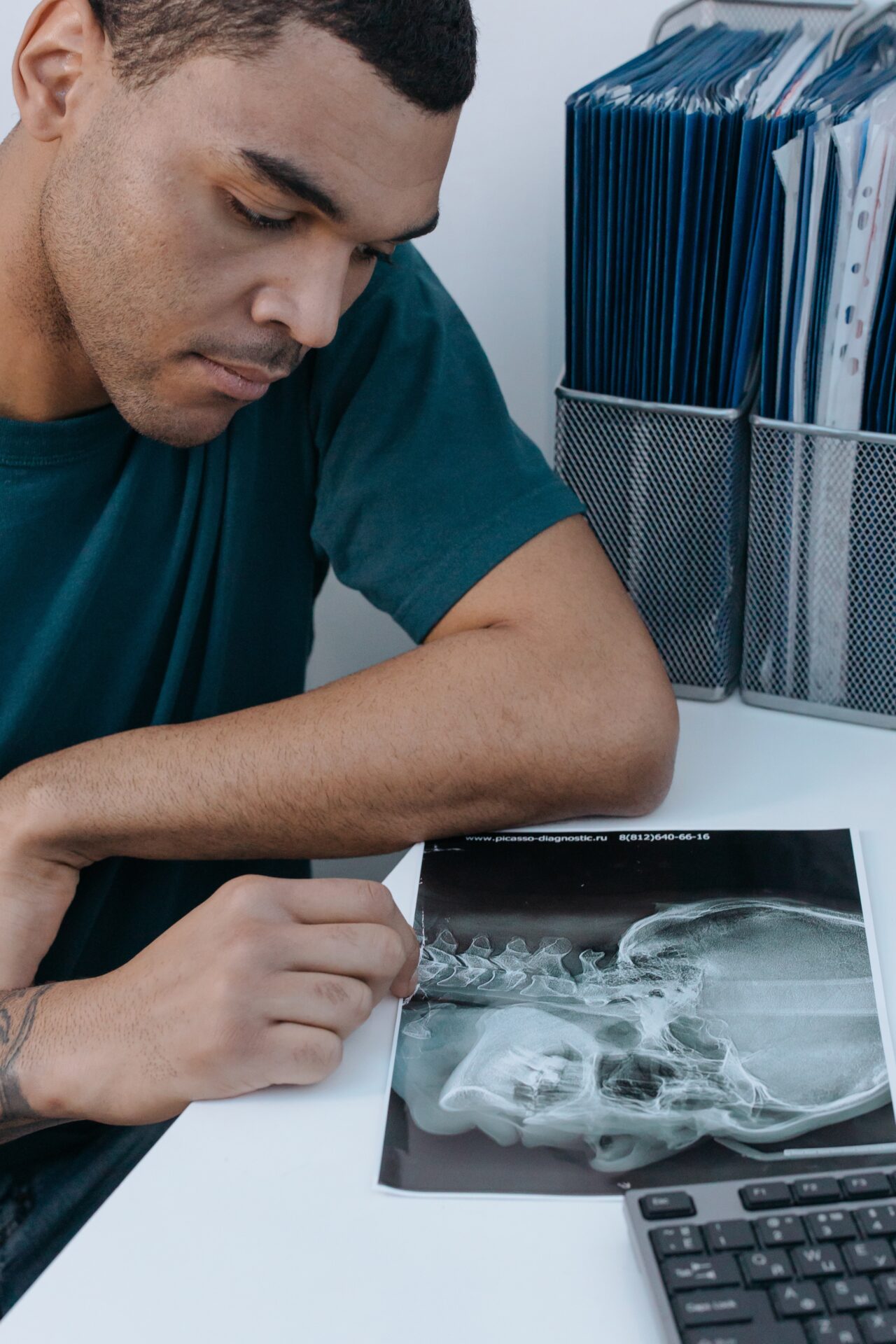 A person checking the x-ray scan copy